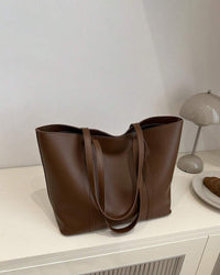 Sleek Leather Tote Bag with Structured Strap Detail
